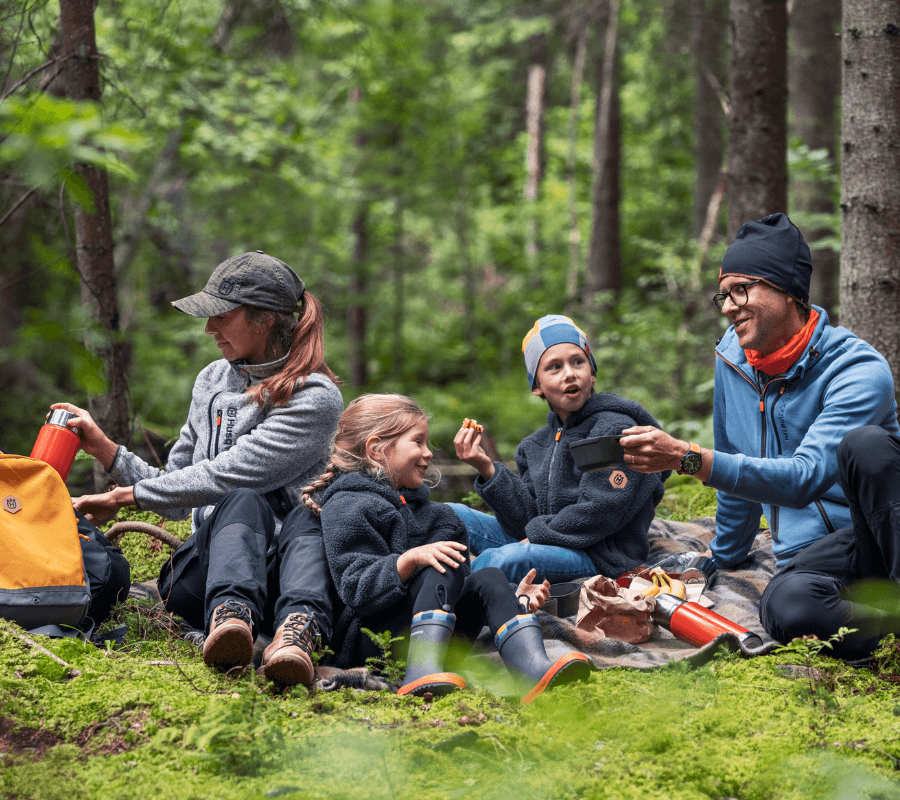 Family in the woods having a picnic